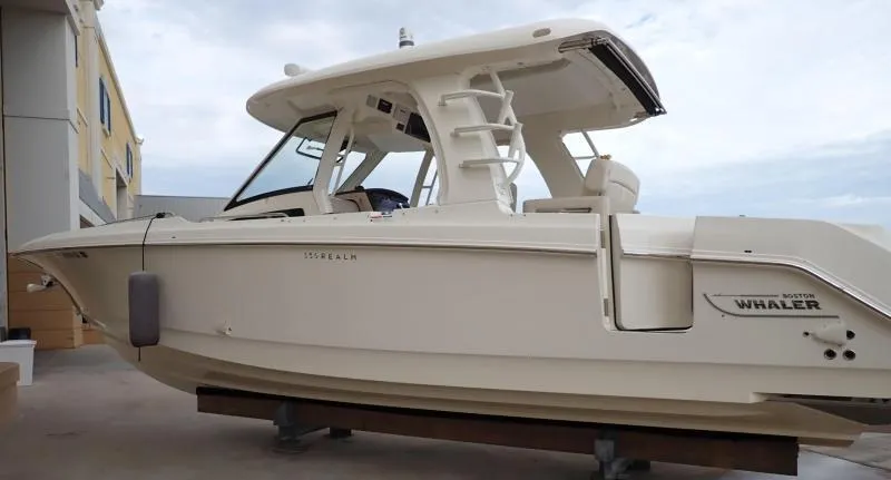 Slide: The Image of 2020 Boston Whaler 350 Realm boat on display, side view. - 13