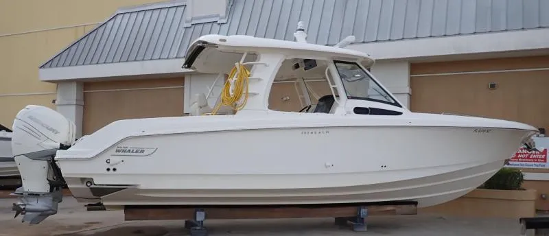 Slide: The Image of 2020 Boston Whaler 350 Realm boat displayed on a stand, side view. - 15