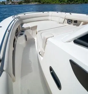 Slide: The Image of 2020 Boston Whaler 350 Realm boat interior with spacious seating and sleek design. - 5