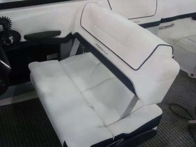 Slide: The Image of 2014 Formula 270 Bowrider boat seat with white upholstery and black accents. - 10