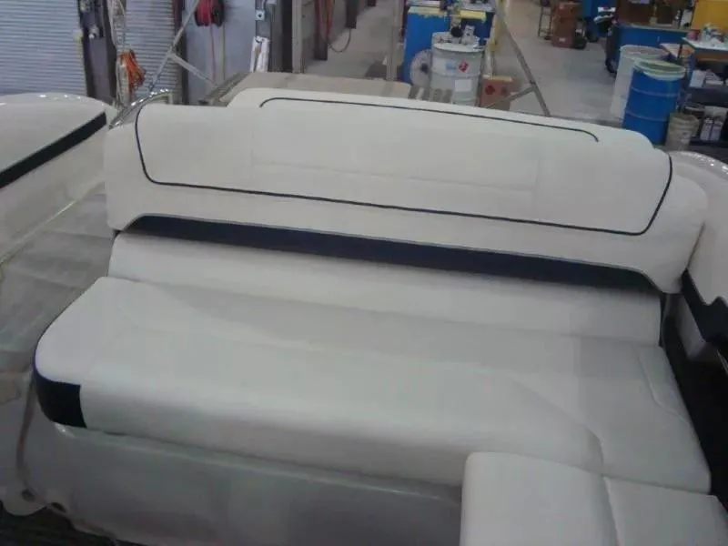 Slide: The Image of 2014 Formula 270 Bowrider interior seating, featuring white upholstery with black accents. - 12