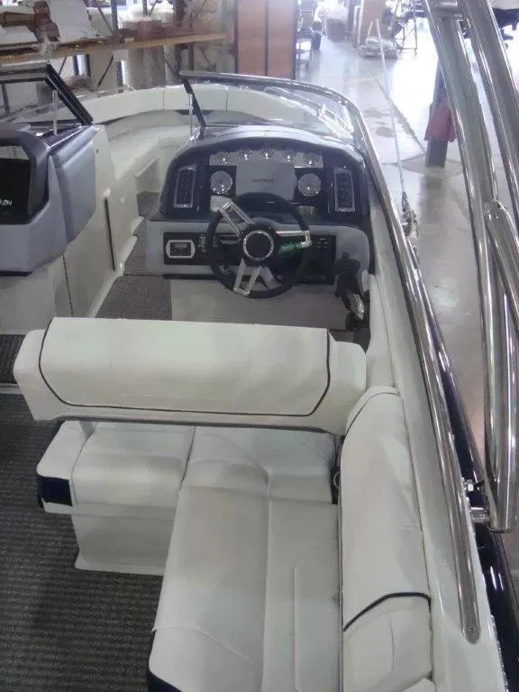 Slide: The Image of 2014 Formula 270 Bowrider interior with white seating and modern dashboard. - 13