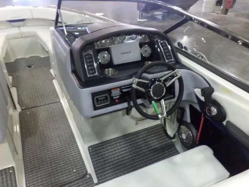 Slide: The Image of 2014 Formula 270 Bowrider boat interior with steering wheel and dashboard controls. - 4