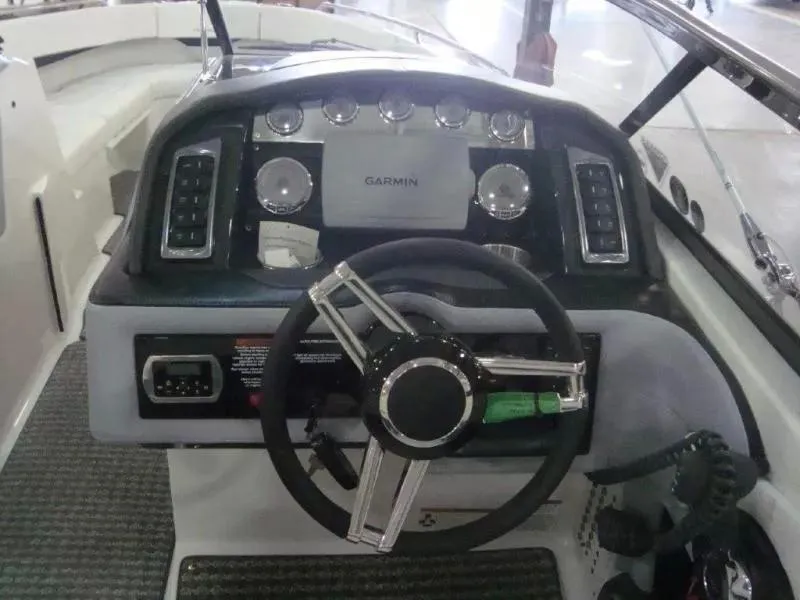 Slide: The Image of 2014 Formula 270 Bowrider dashboard with Garmin navigation and modern controls. - 6