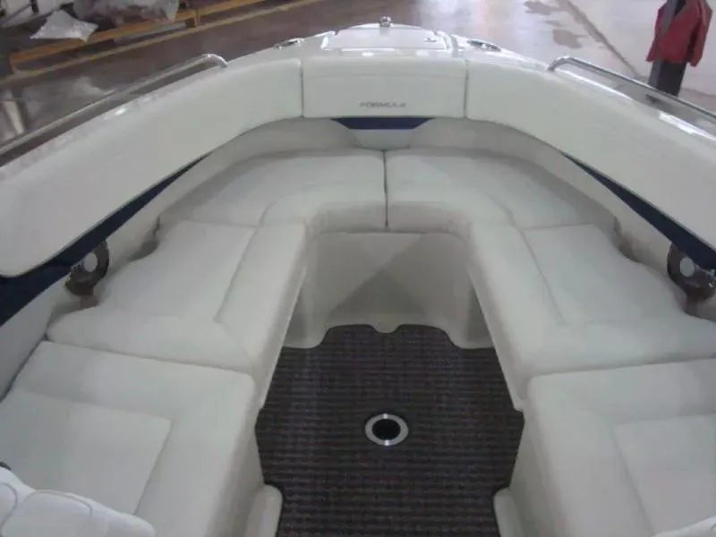 Slide: The Image of 2014 Formula 270 Bowrider interior with white seating and carpeted floor. - 9