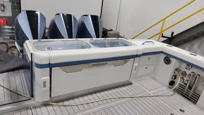 Slide: The Image of 2025 Formula 387 Center Console Fish boat with triple outboard engines and spacious deck. - 10