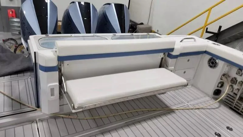 Slide: The Image of 2025 Formula 387 Center Console Fish boat with foldable seating and triple outboard engines. - 11