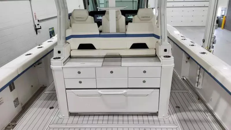 Slide: The Image of 2025 Formula 387 Center Console Fish boat interior with seating and storage compartments. - 14