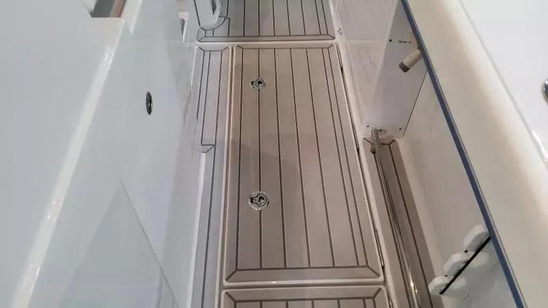 Slide: The Image of 2025 Formula 387 Center Console Fish boat deck with sleek, modern design and storage compartments. - 19