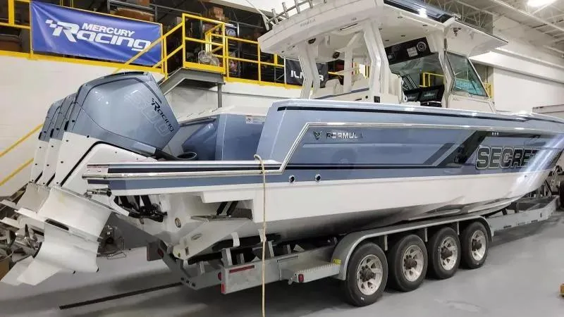 Slide: The Image of 2025 Formula 387 Center Console Fish boat on trailer in a showroom. - 3