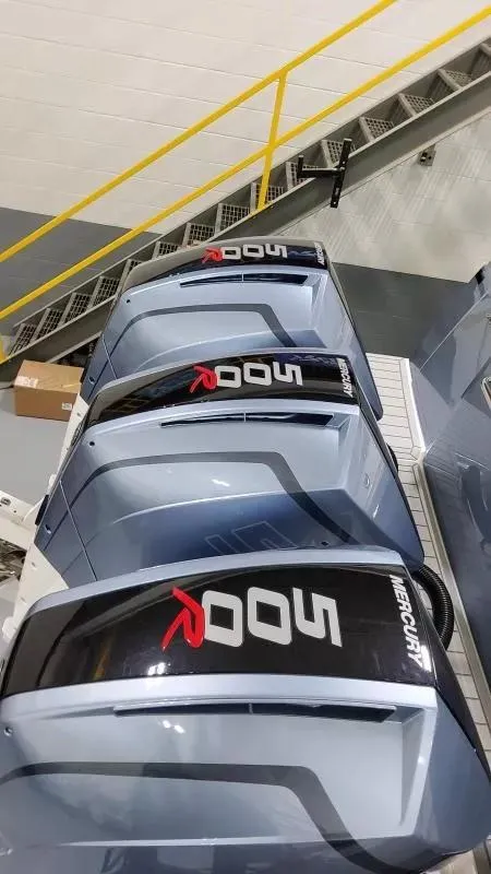 Slide: The Image of Four Mercury outboard engines on a 2025 Formula 387 Center Console Fish boat. - 6