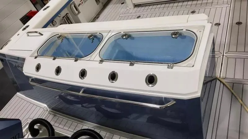 Slide: The Image of 2025 Formula 387 Center Console Fish boat with dual livewells and sleek design. - 7