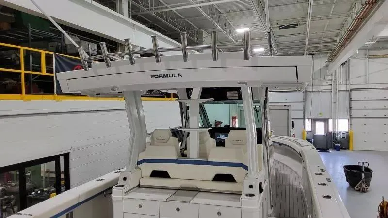 Slide: The Image of 2025 Formula 387 Center Console Fish boat in a warehouse setting. - 9