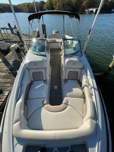 Slide: The Image of 2017 Crownline Eclipse E6 XS boat docked on a serene lake. - 13