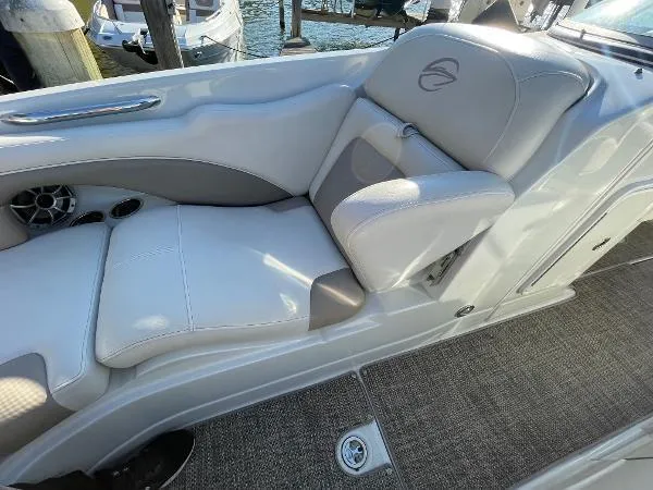 Slide: The Image of 2017 Crownline Eclipse E6 XS boat interior with gray seating and carpeted flooring. - 15