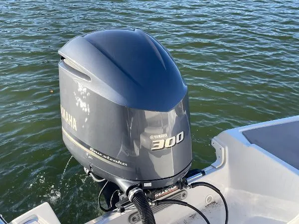 Slide: The Image of 2017 Crownline Eclipse E6 XS with Yamaha 300 outboard motor on water. - 5