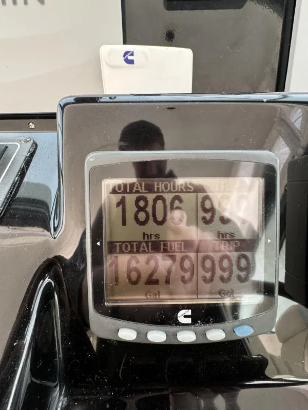 Slide: The Image of Display screen showing engine hours and fuel usage on a 2004 Tiara Sport 4200 Open. - 11