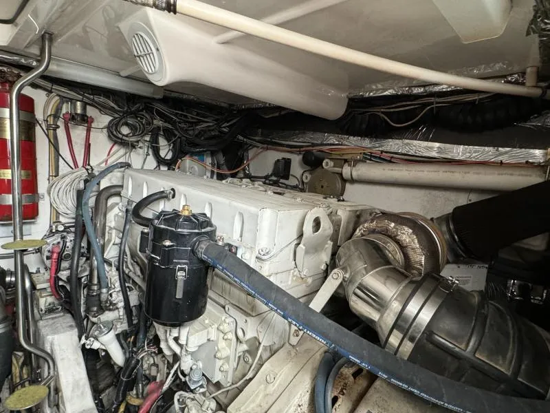 Slide: The Image of Engine room of a 2004 Tiara Sport 4200 Open boat, showcasing mechanical components. - 13