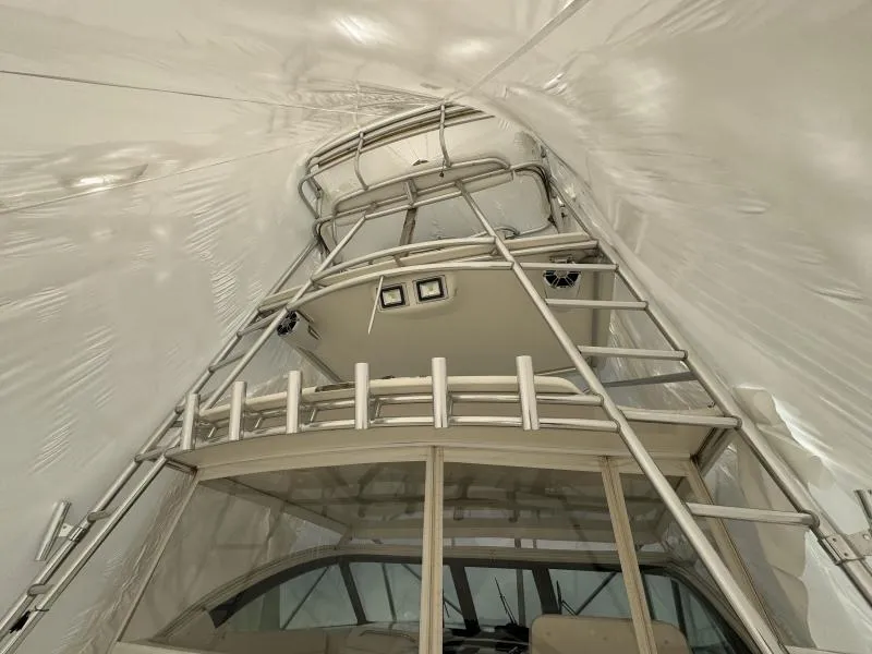 Slide: The Image of 2004 Tiara Sport 4200 Open yacht interior with sleek metal framework and modern design. - 14