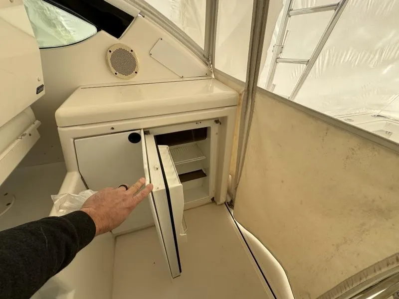 Slide: The Image of 2004 Tiara Sport 4200 Open yacht interior with open mini fridge. - 20