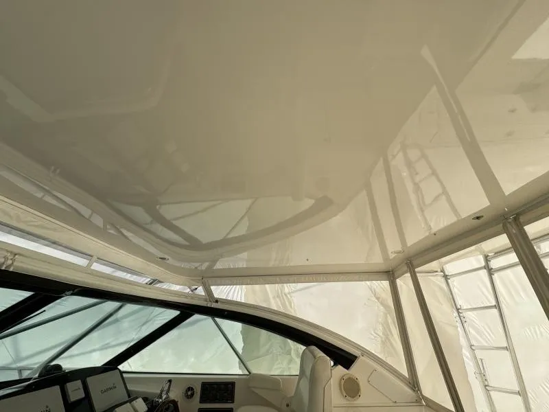 Slide: The Image of Interior view of 2004 Tiara Sport 4200 Open yacht, showcasing helm and canopy. - 21