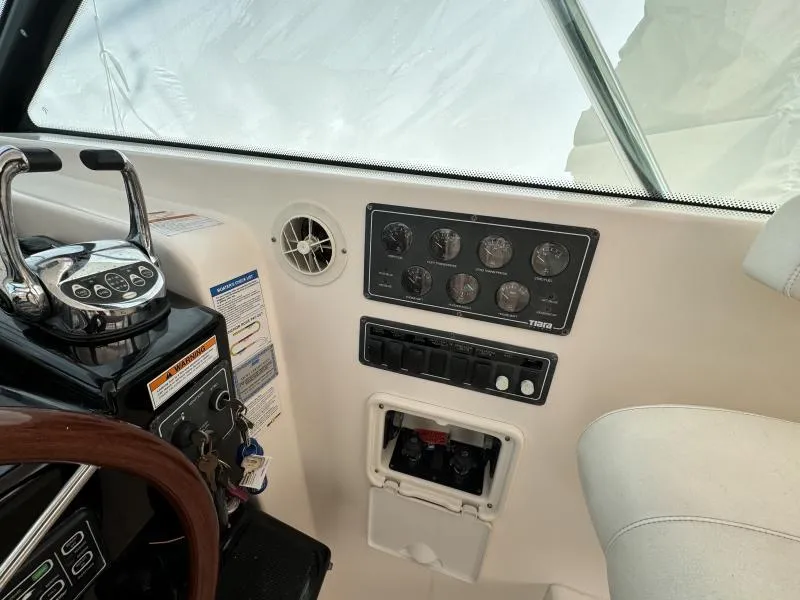 Slide: The Image of Control panel of a 2004 Tiara Sport 4200 Open boat cockpit. - 23