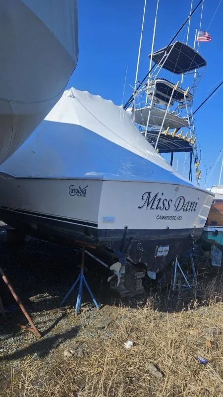 Slide: The Image of 2006 Carolina Classic 280 Express boat, named "Miss Dani," in dry dock. - 11