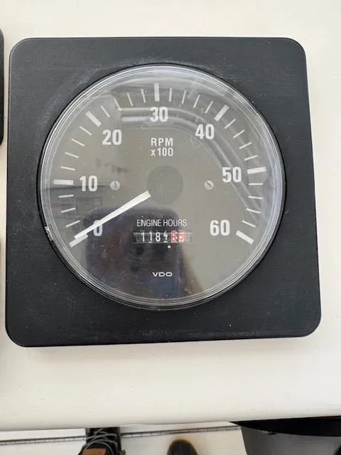 Slide: The Image of Tachometer showing RPM and engine hours on 2006 Carolina Classic 280 Express. - 14