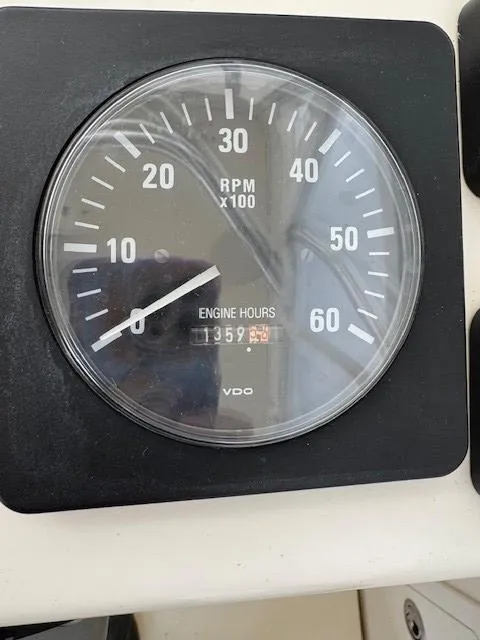 Slide: The Image of Tachometer showing 1359 engine hours on a 2006 Carolina Classic 280 Express. - 15