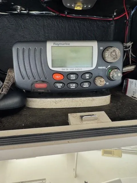 Slide: The Image of Raymarine VHF radio on a 2006 Carolina Classic 280 Express boat dashboard. - 19