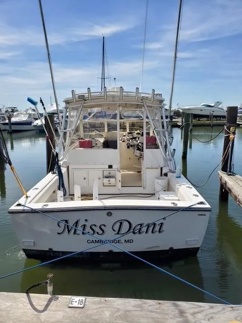 Slide: The Image of 2006 Carolina Classic 280 Express boat named "Miss Dani" docked in Cambridge, MD marina. - 2