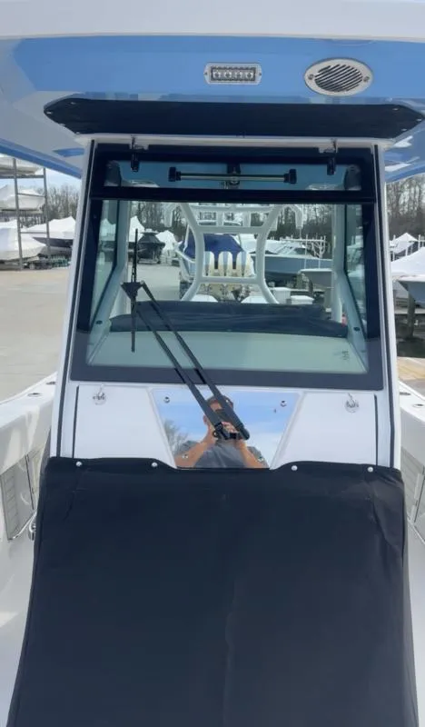 Slide: The Image of 2025 Blackfin 272 Center Console boat, front view with windshield and wiper. - 14