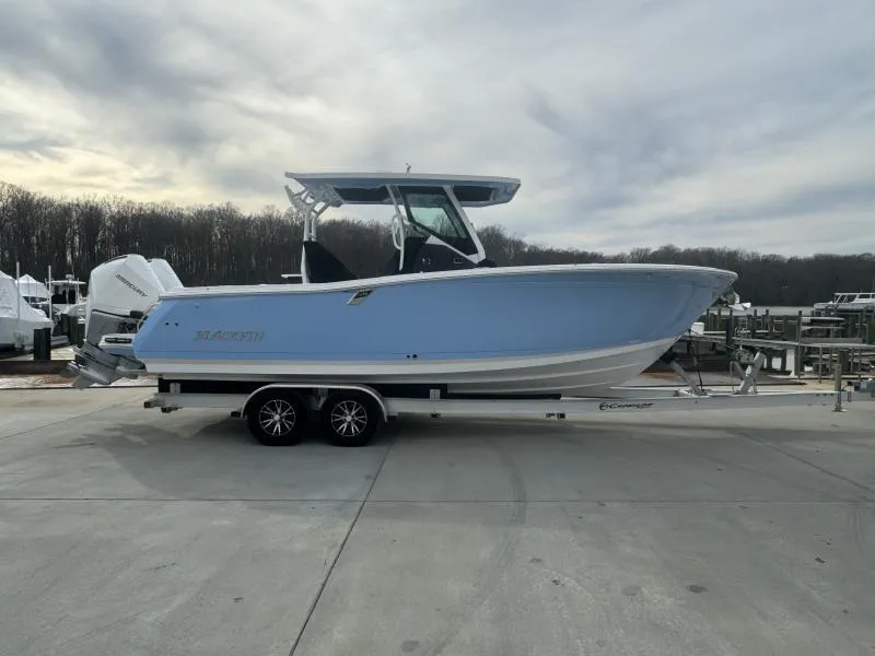 Slide: The Image of 2025 Blackfin 272 Center Console boat on trailer, parked outdoors under cloudy sky. - 4