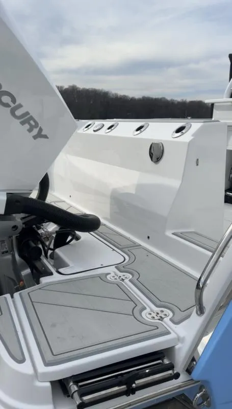 Slide: The Image of 2025 Blackfin 272 Center Console boat deck with Mercury engine, featuring sleek design and modern fittings. - 8