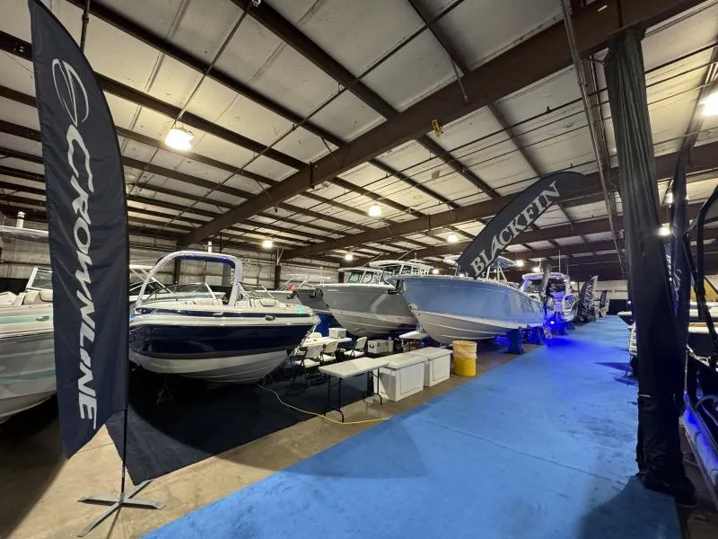 Slide: The Image of Indoor boat show featuring 2025 Blackfin 332 and Crownline models on display. - 12