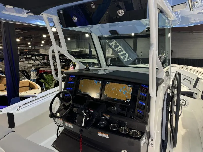 Slide: The Image of 2025 Blackfin 332 boat cockpit with advanced navigation displays and controls. - 7