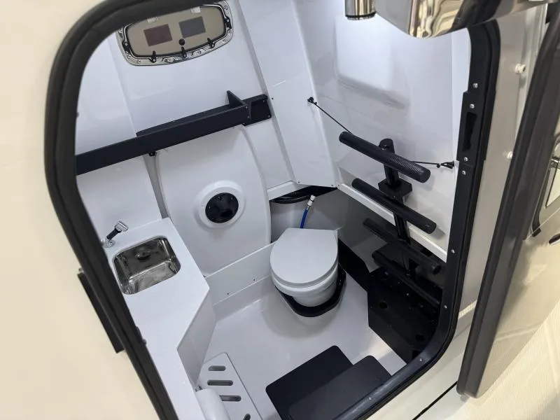 Slide: The Image of 2025 Blackfin 332 boat interior with compact bathroom and modern amenities. - 9