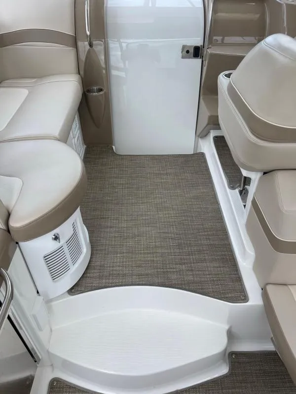 Slide: The Image of 2016 Formula Boats 37 PC interior with beige seating and carpeted flooring. - 10