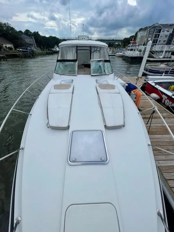 Slide: The Image of 2016 Formula Boats 37 PC docked, showcasing sleek design and spacious deck. - 12