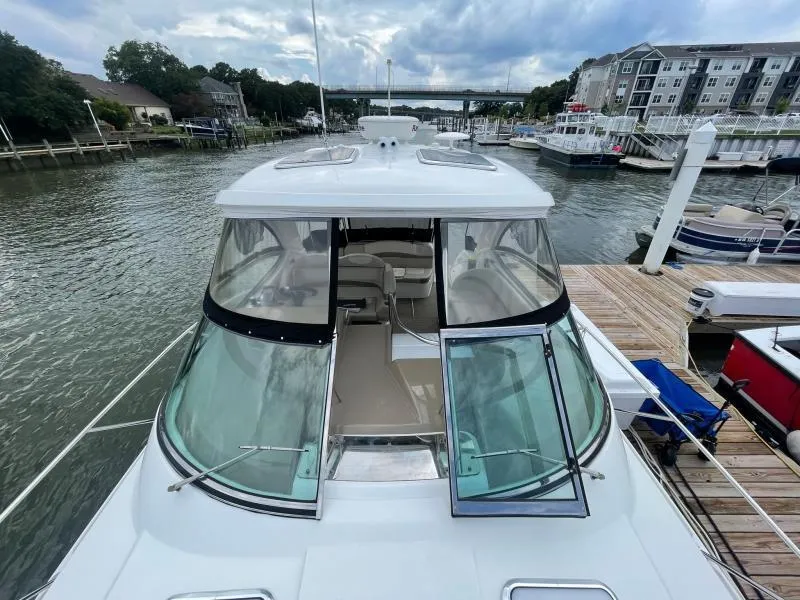 Slide: The Image of 2016 Formula Boats 37 PC docked at marina, showcasing sleek design and spacious interior. - 13