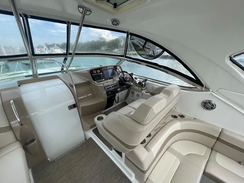 Slide: The Image of 2016 Formula Boats 37 PC cockpit with modern controls and beige seating. - 19