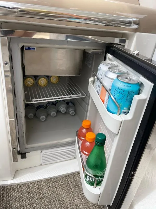 Slide: The Image of Mini fridge stocked with drinks on a 2016 Formula Boats 37 PC. - 21