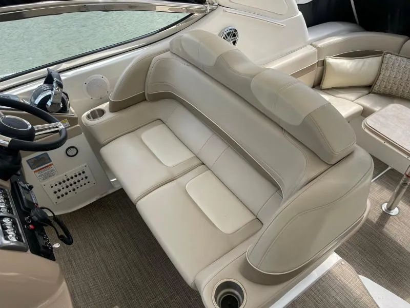 Slide: The Image of Luxurious interior of 2016 Formula Boats 37 PC with beige seating and helm. - 24