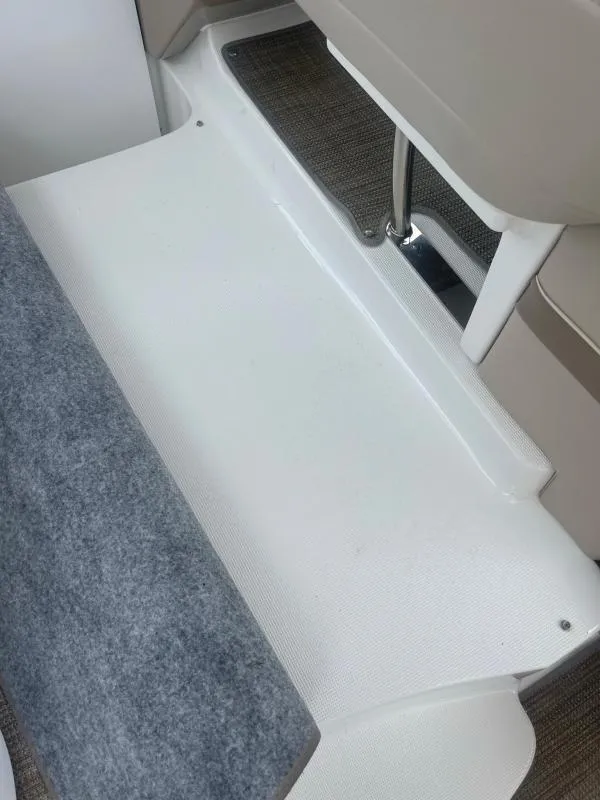 Slide: The Image of Interior view of a 2016 Formula Boats 37 PC, featuring seating and flooring details. - 9