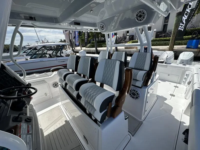 Slide: The Image of Interior of a 2025 Blackfin 400 boat with luxurious seating and modern design. - 11