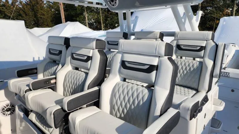 Slide: The Image of 2025 Blackfin 400 boat interior with luxurious, diamond-stitched seating and modern design. - 17