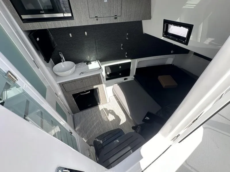 Slide: The Image of Luxurious interior of 2025 Blackfin 400 boat featuring modern amenities and sleek design. - 5