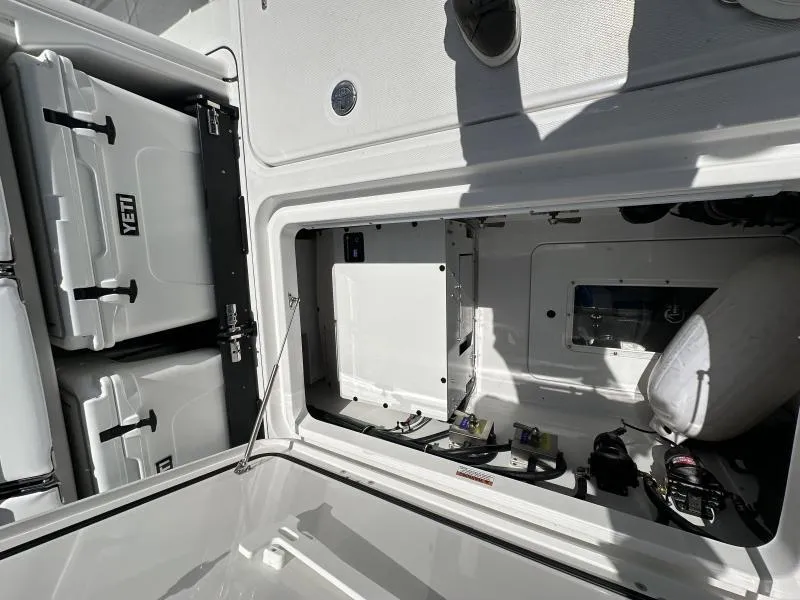 Slide: The Image of Interior view of a 2025 Blackfin 400 boat storage compartment with Yeti coolers. - 8