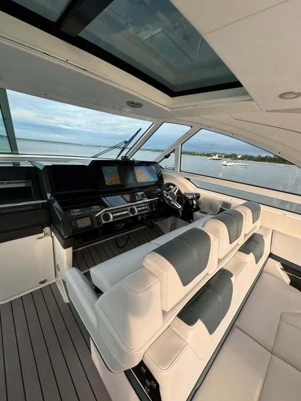 Slide: The Image of Interior of 2020 Formula 400 Super Sport Crossover yacht with modern helm and seating. - 14