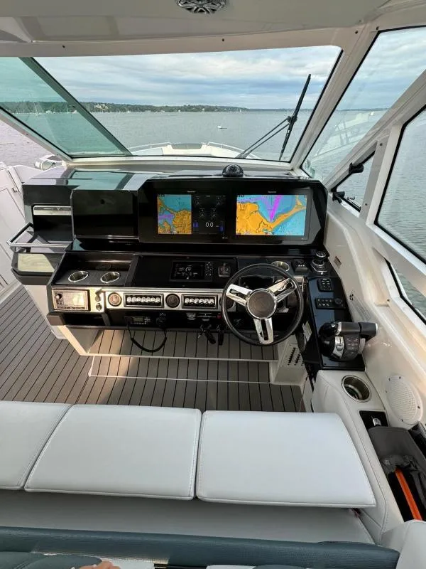 Slide: The Image of 2020 Formula 400 Super Sport Crossover helm with advanced navigation displays and controls. - 16